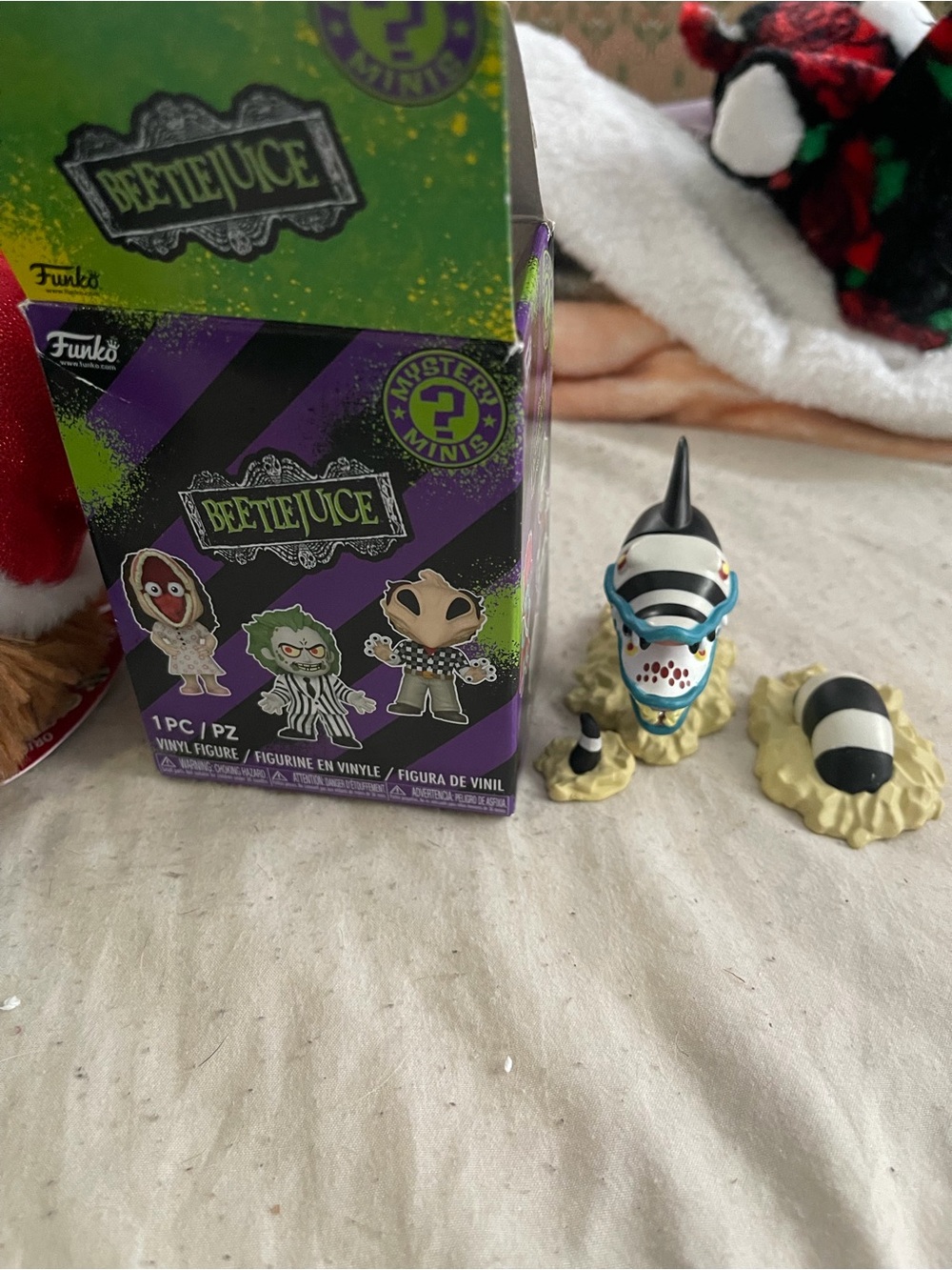 Beetlejuice Funko figure on bed